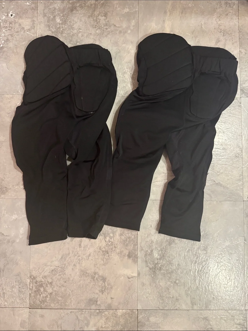 Under Armour youth, small padded, black football pants